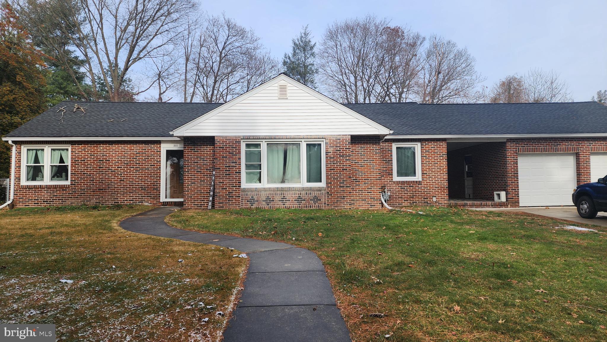 211 University Boulevard Glassboro, NJ 08028 - Photo 1 of 22 a front view of a house with a yard and garage