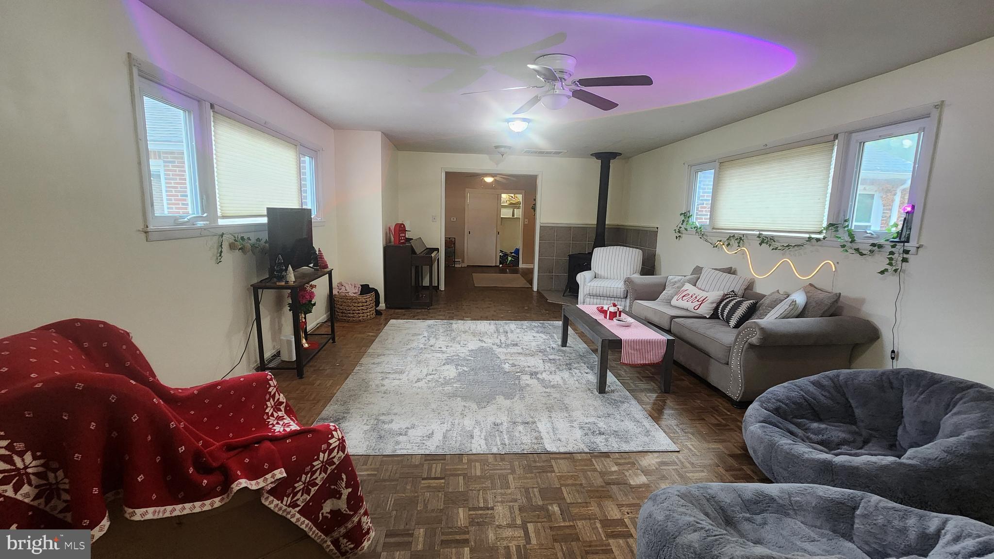 211 University Boulevard Glassboro, NJ 08028 - Photo 12 of 22 a living room with furniture and a wooden floor