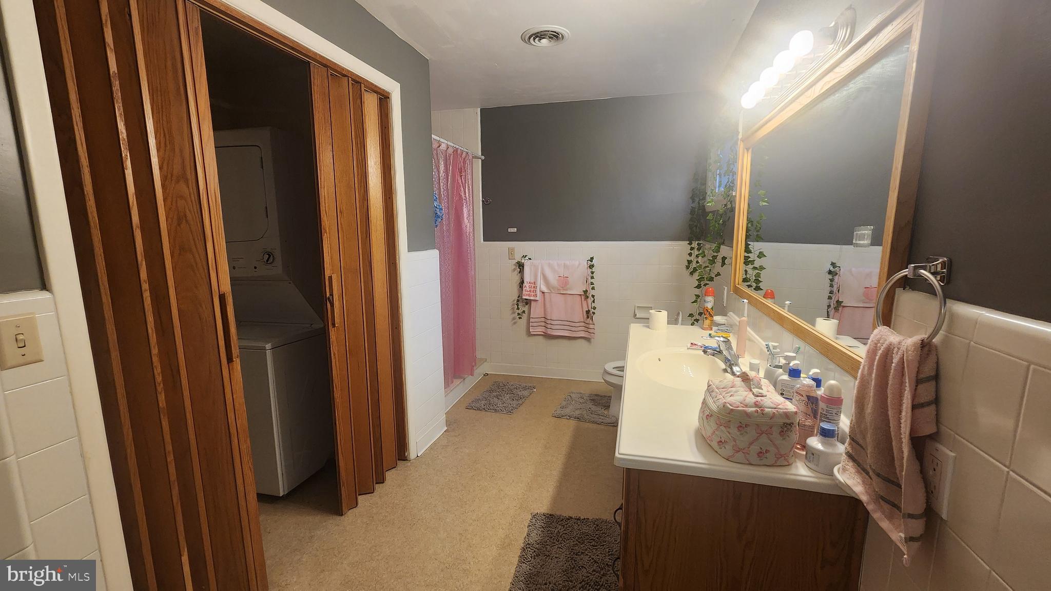 211 University Boulevard Glassboro, NJ 08028 - Photo 15 of 22 a bathroom with a sink and mirror