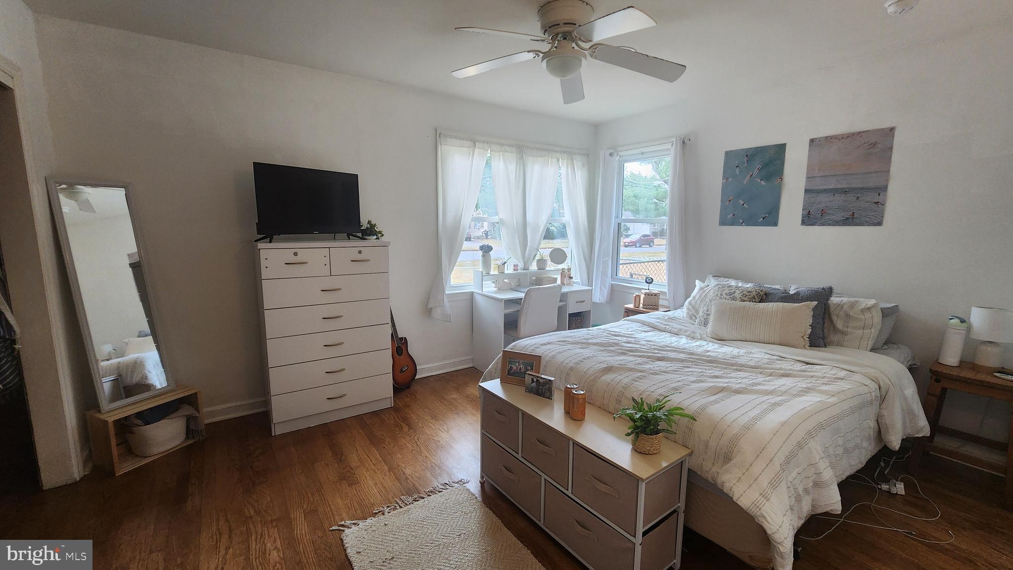 211 University Boulevard Glassboro, NJ 08028 - Photo 16 of 22 a bedroom with a bed and flat screen tv