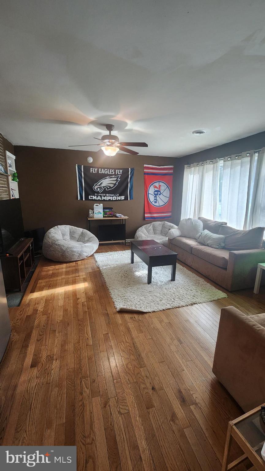 211 University Boulevard Glassboro, NJ 08028 - Photo 3 of 22 a living room with furniture and a flat screen tv