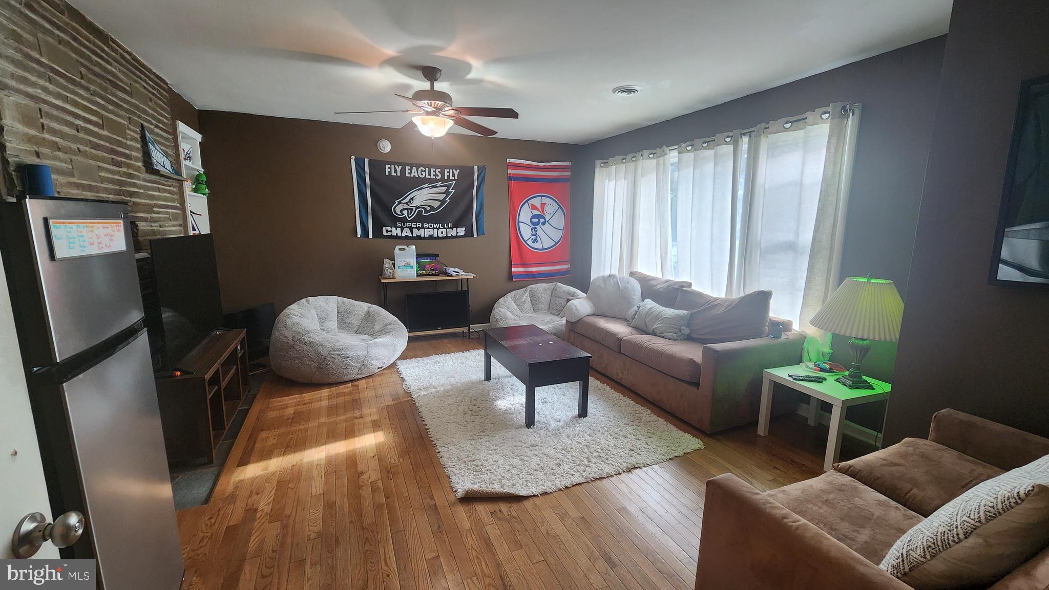 211 University Boulevard Glassboro, NJ 08028 - Photo 4 of 22 a living room with furniture and a chandelier