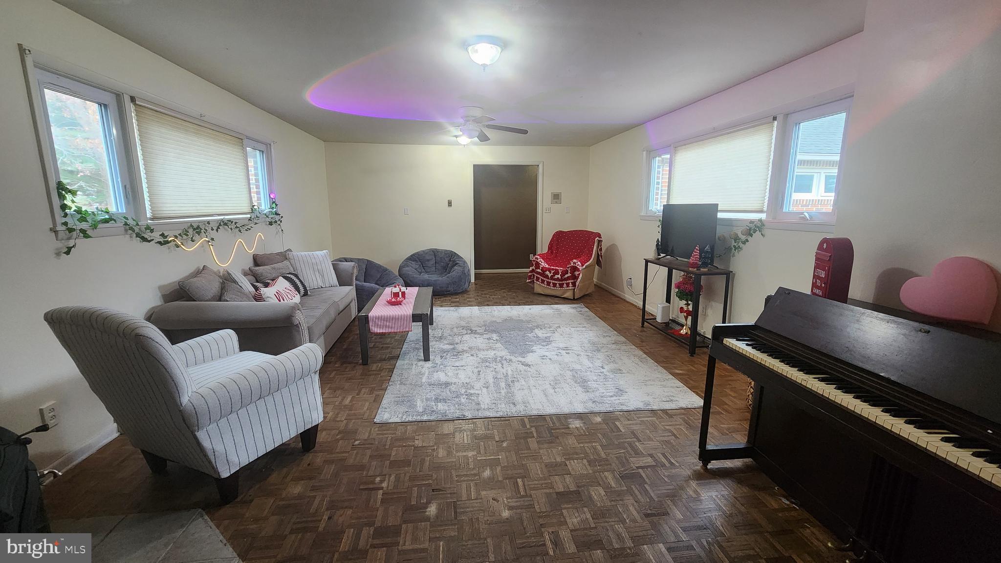 211 University Boulevard Glassboro, NJ 08028 - Photo 10 of 22 a living room with furniture and a wooden floor