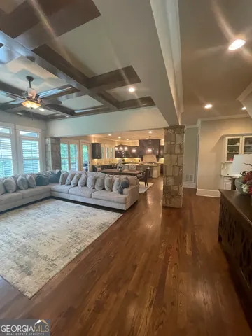 a view of a living room and kitchen floor