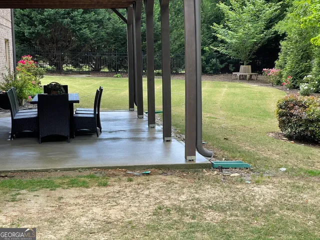 a view of a swimming pool with a patio