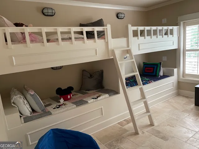 a bedroom with furniture and a fireplace