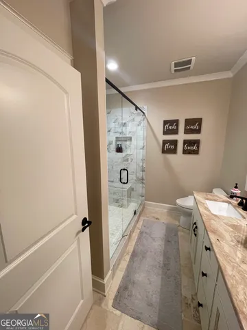 a bathroom with a granite countertop sink a mirror and a bathtub