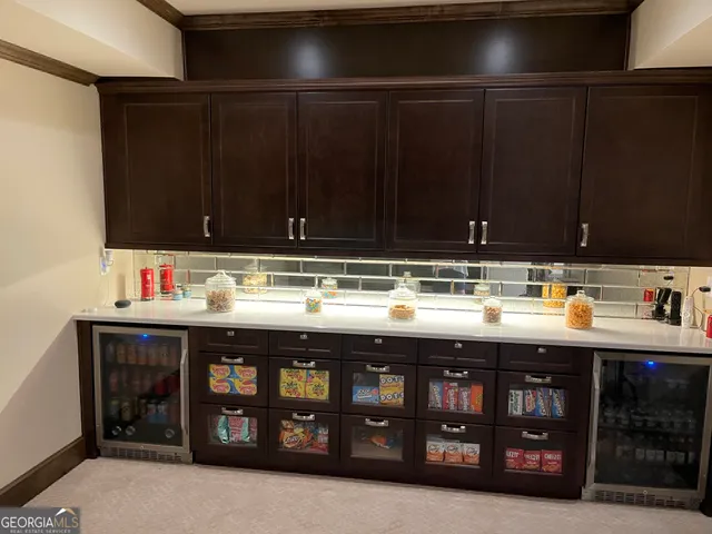 a room with furniture cabinets and window