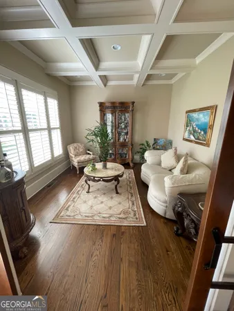 a living room with furniture and a table