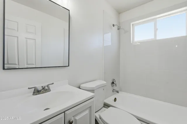 a bathroom with a sink and vanity