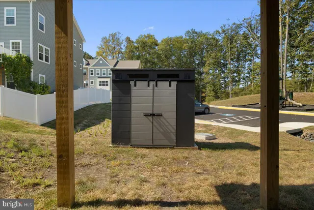 a view of a wooden door and a road
