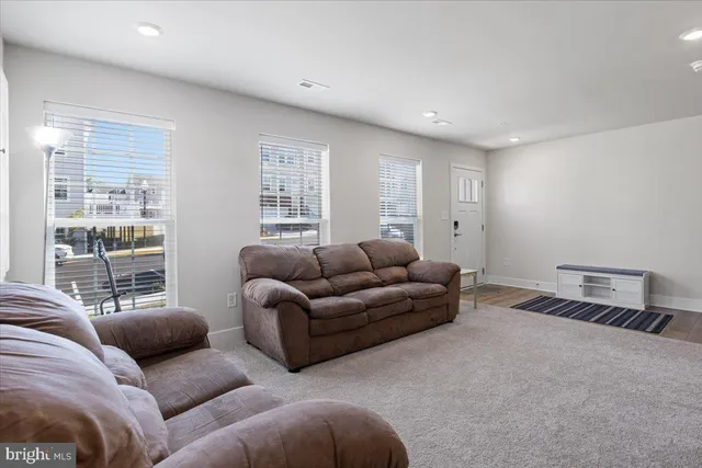 a living room with furniture window and a lamp