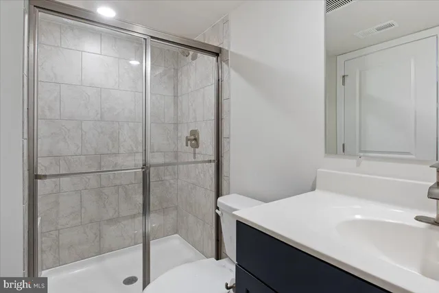 a bathroom with a sink and a shower