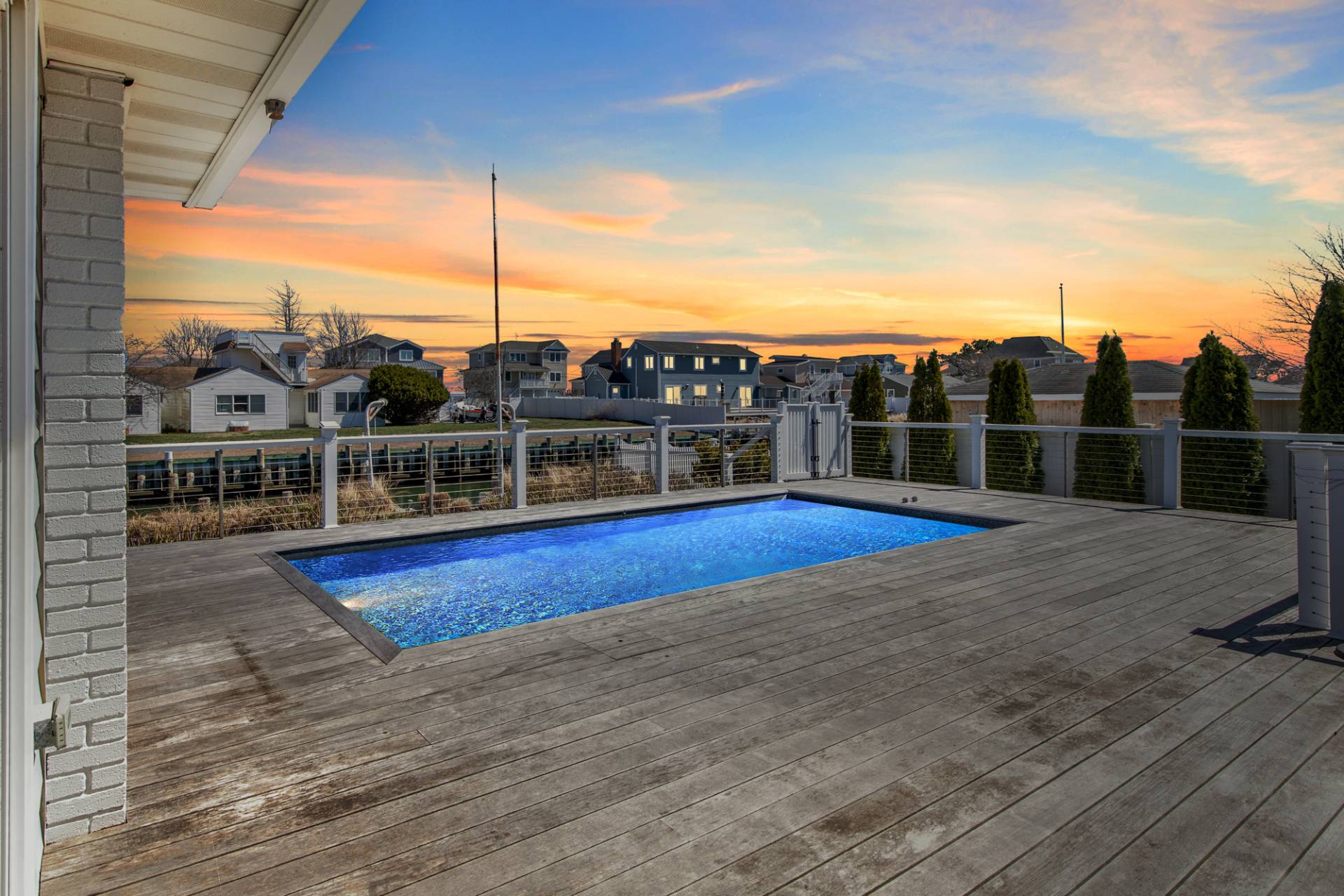 13 Marlin Road East Quogue, NY 11942 - Photo 19 of 22 a view of houses with sky view