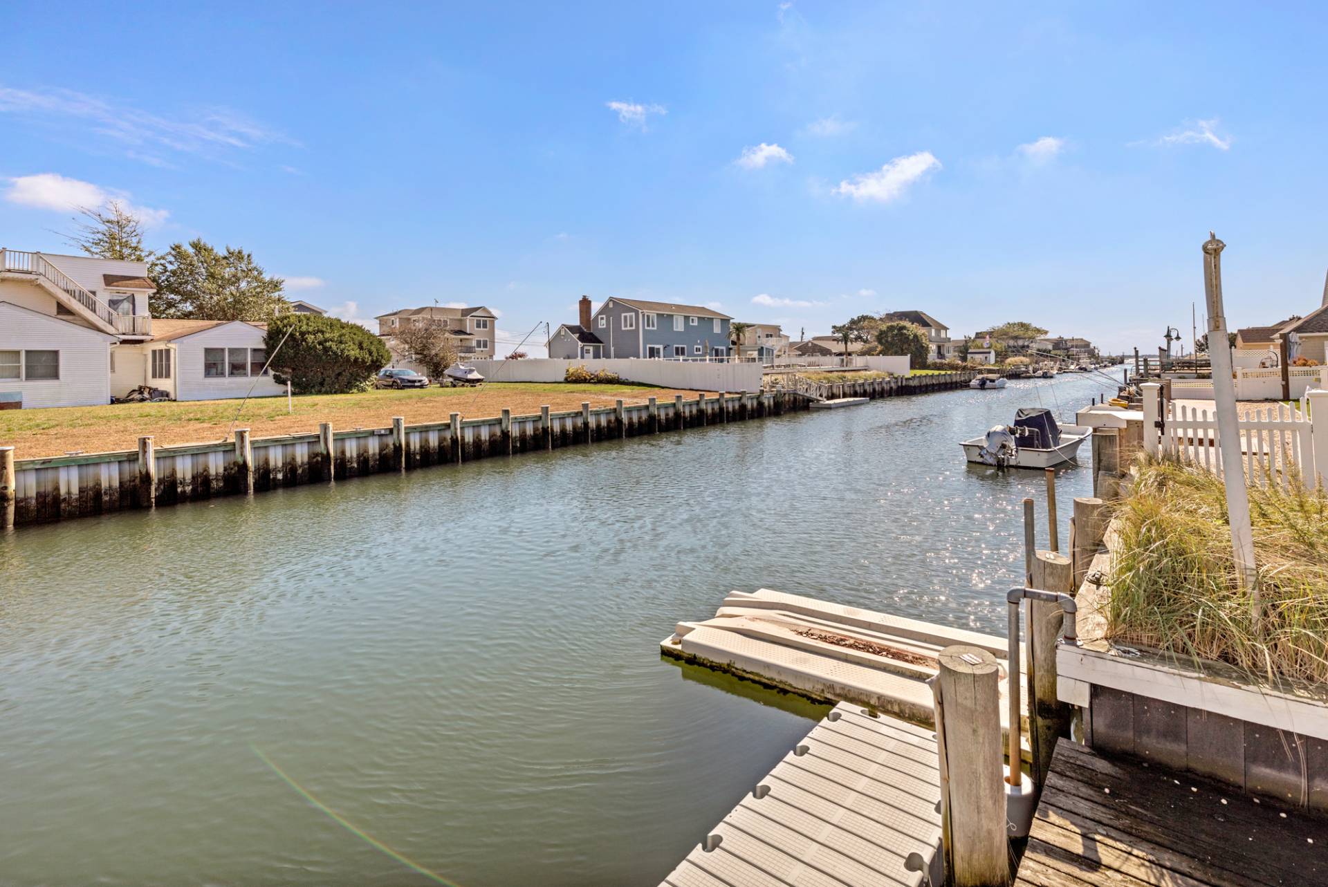 13 Marlin Road East Quogue, NY 11942 - Photo 22 of 22 a view of a lake with house
