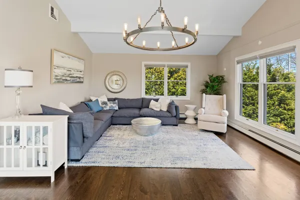 a living room with furniture and a large window