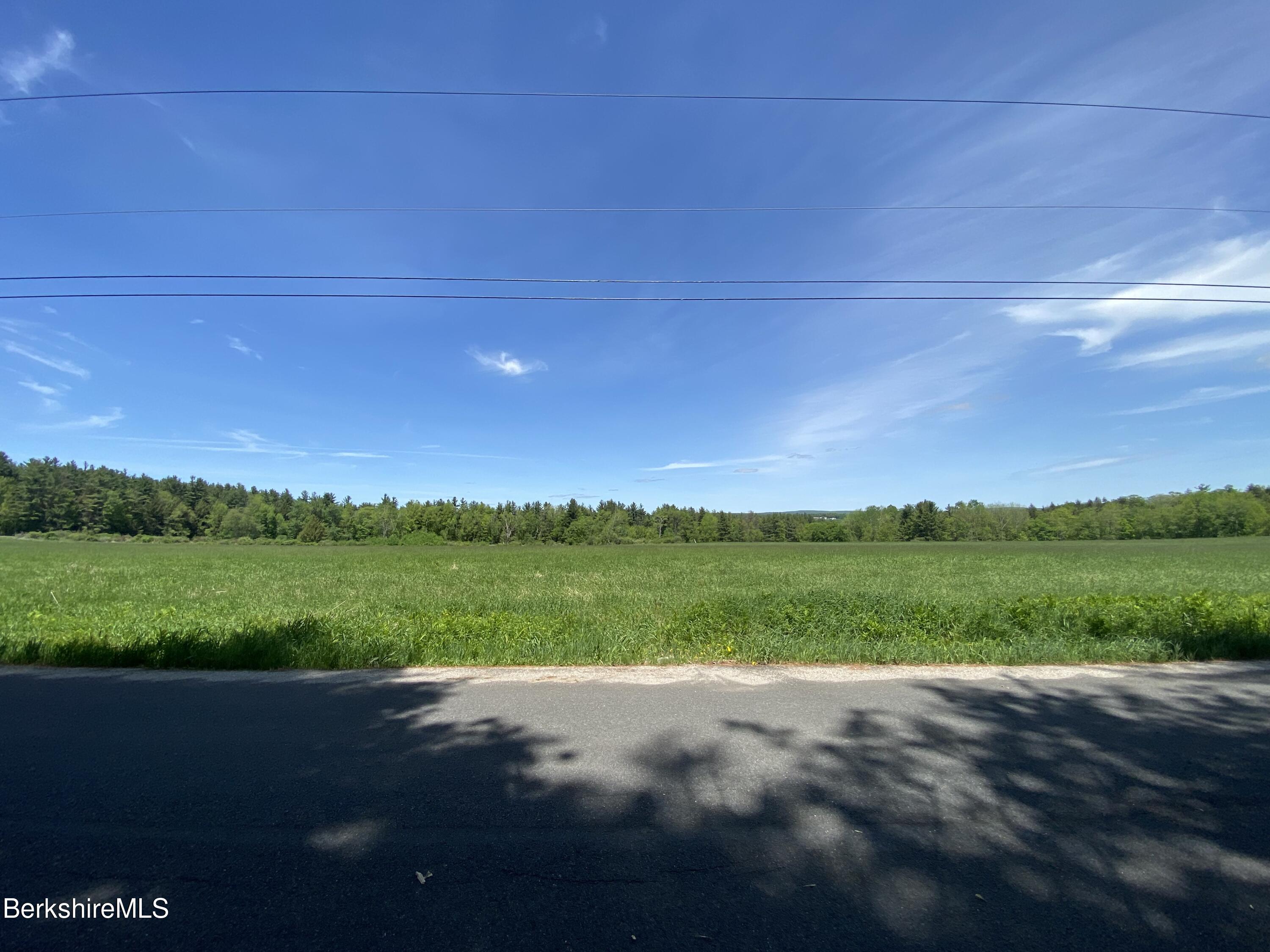 0 Bryant Road Cummington, MA 01026 - Photo 12 of 14 a view of a field of grass and a building
