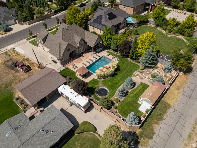 687 South 2080th Street East Springville, UT 84663 - Photo 70 of 149 Expansive outdoor oasis featuring a large swimming pool with rock detailing, a dedicated patio area, a gazebo, and mature landscaping with a variety of trees and shrubs