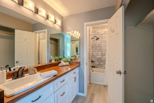 11957 Noelle Road Sandy, UT 84092 - Photo 25 of 38 Double vanity with a wood-finish countertop and white cabinetry