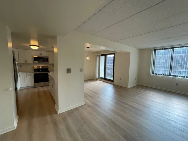 a view of a kitchen cabinets and wooden floor
