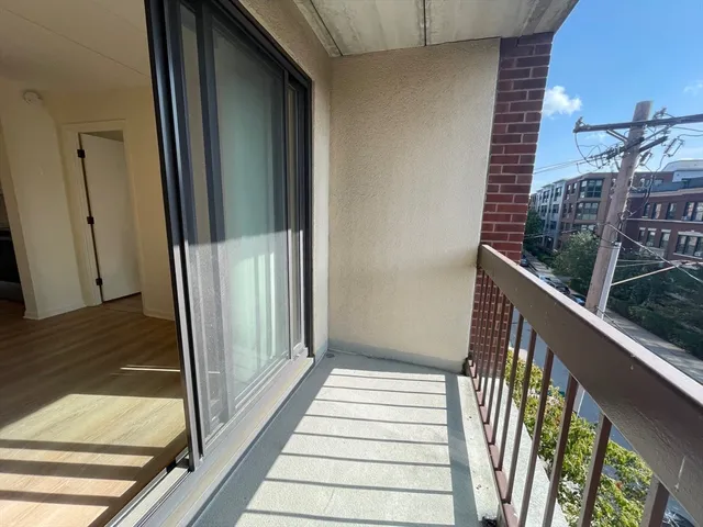 a view of balcony and wooden floor