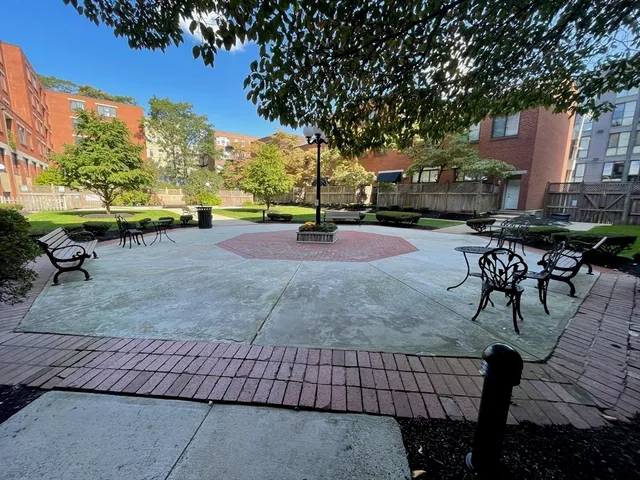 a view of a backyard with sitting area