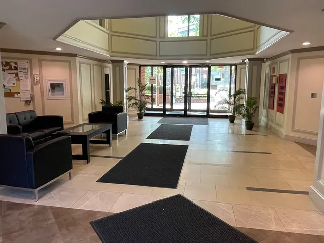 a lobby with furniture and window
