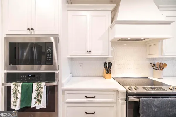 a kitchen with a stove and a microwave