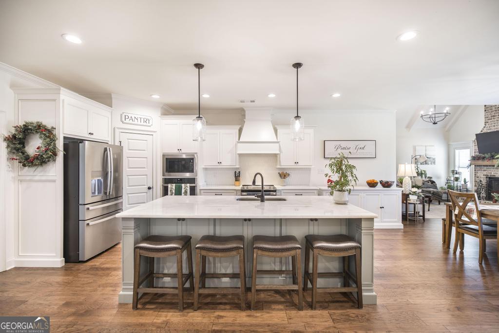 206 Bristleleaf Path Kathleen, GA 31047 - Photo 14 of 33 a large kitchen with a table and chairs