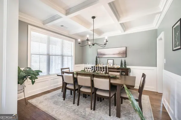 a view of a dining room with furniture window and outside view