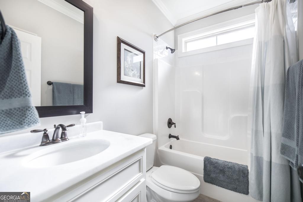 206 Bristleleaf Path Kathleen, GA 31047 - Photo 20 of 33 a bathroom with a sink a toilet and shower