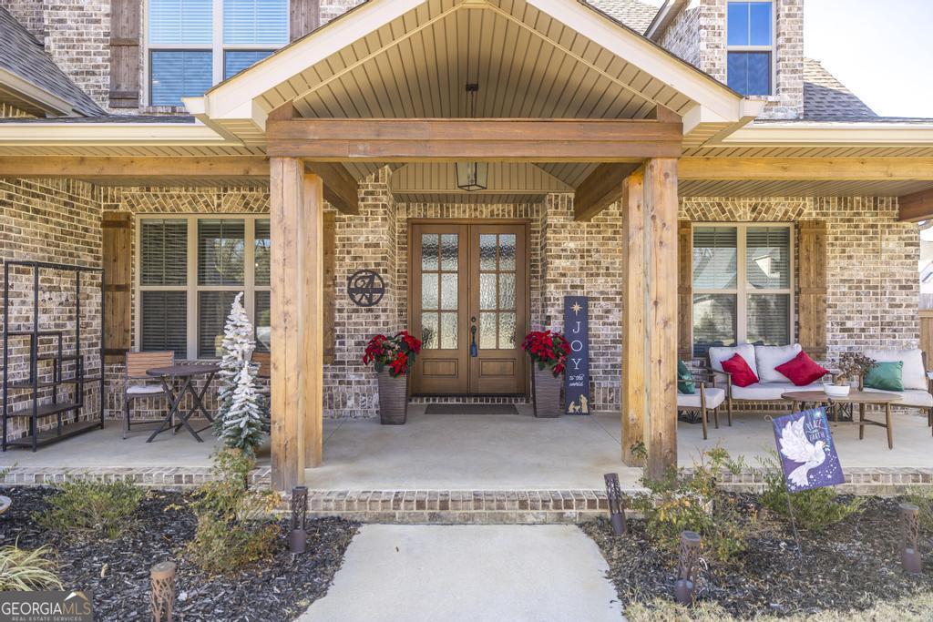 206 Bristleleaf Path Kathleen, GA 31047 - Photo 2 of 33 a view of a patio with table and chairs potted plants