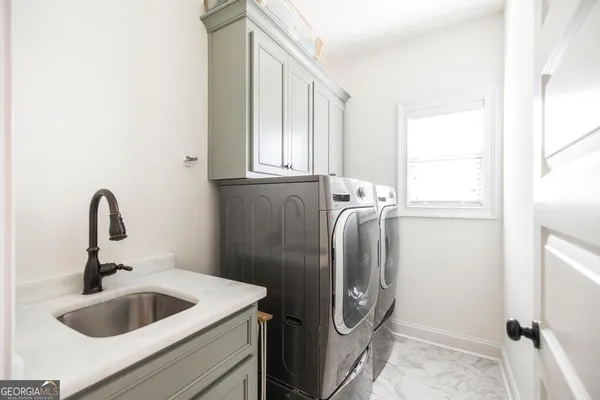 a kitchen with a refrigerator and a sink