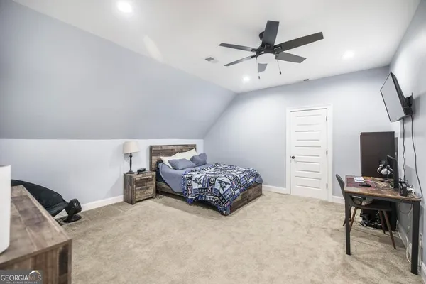 a bedroom with furniture and a bed