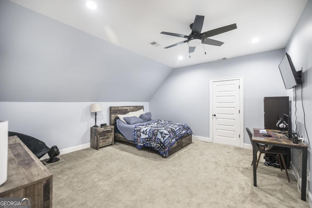 206 Bristleleaf Path Kathleen, GA 31047 - Photo 25 of 33 a bedroom with furniture and a bed