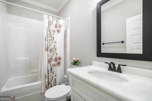 a bathroom with a sink a toilet and a bathtub