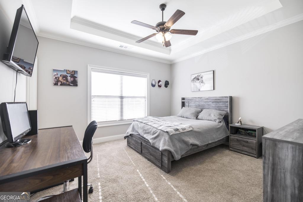 206 Bristleleaf Path Kathleen, GA 31047 - Photo 30 of 33 a bedroom with a bed window and a flat screen tv