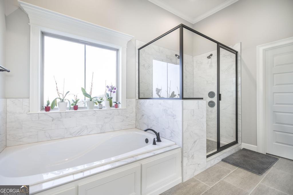 206 Bristleleaf Path Kathleen, GA 31047 - Photo 5 of 33 a bathroom with a bathtub and a shower