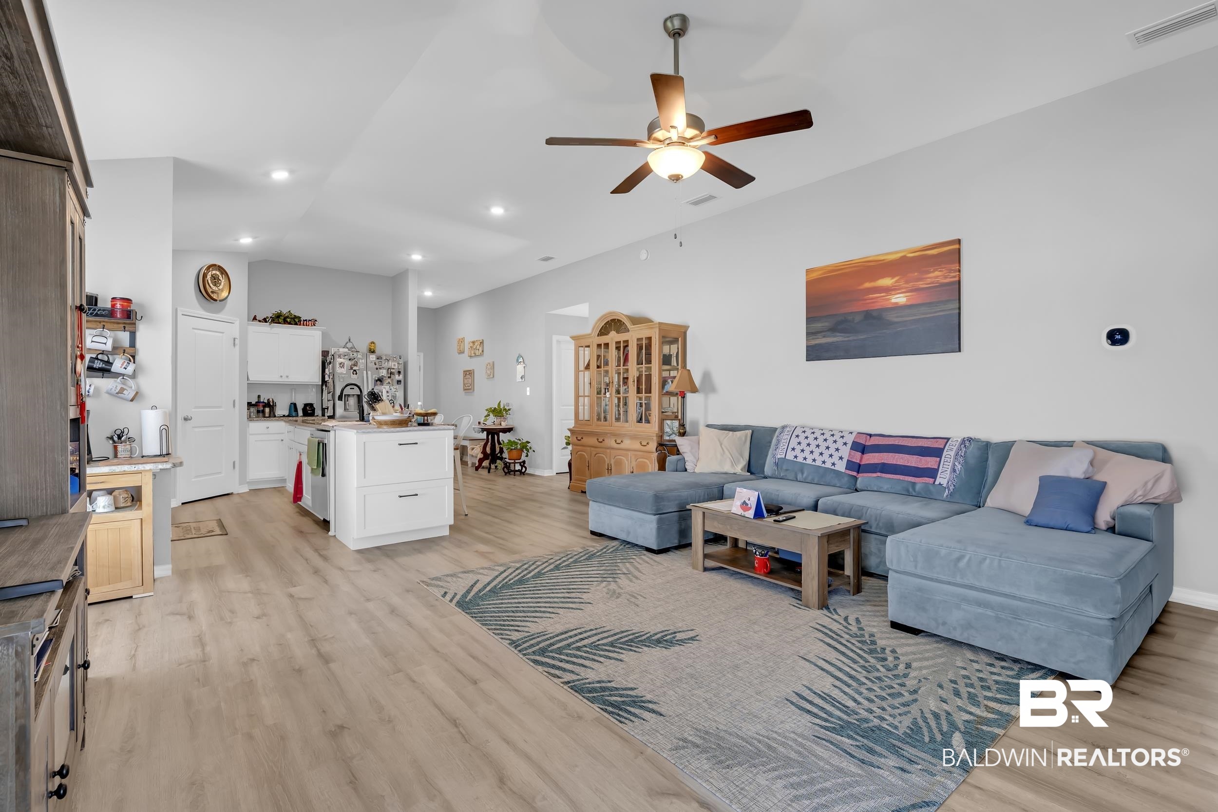 1228 Caper Avenue Foley, AL 36535 - Photo 13 of 54 Open-concept living area featuring wood-finish flooring, recessed lighting, and a ceiling fan with integrated light fixture