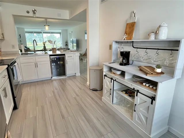 a stove top oven sitting inside of a kitchen