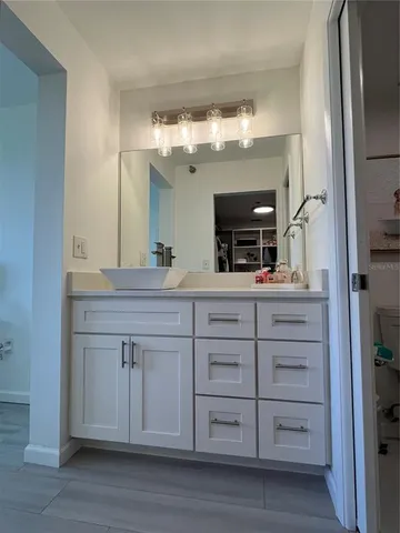 a bathroom with a sink and a mirror