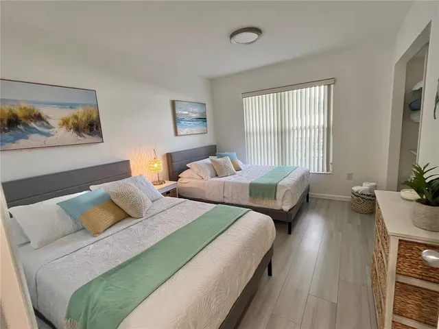 a white toilet sitting next to a bathroom sink and shower