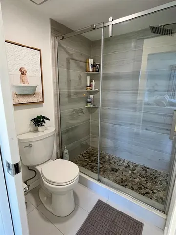 a bathroom with a toilet a sink and bathtub