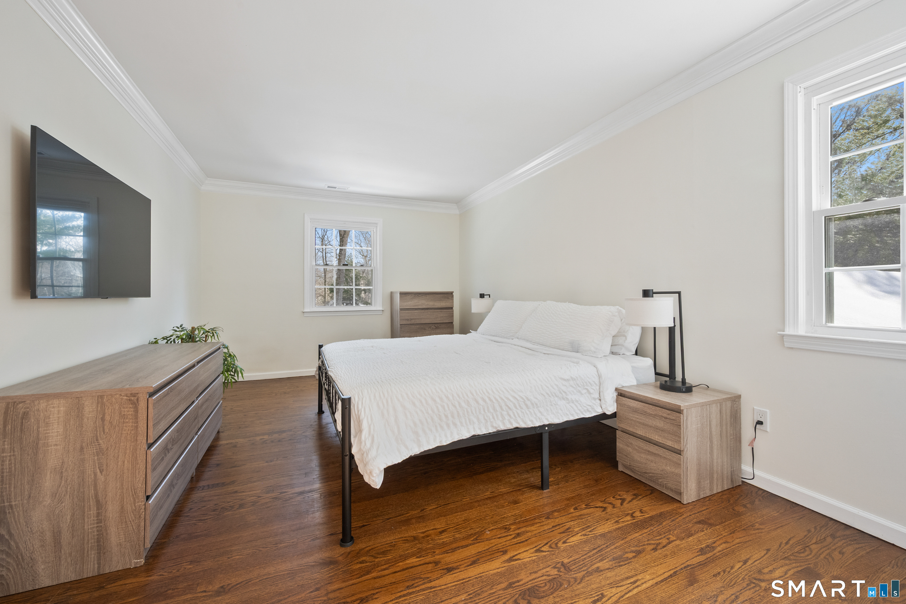 6 Buckboard Lane Fairfield, CT 06824 - Photo 11 of 23 a bedroom with a bed and wooden floor