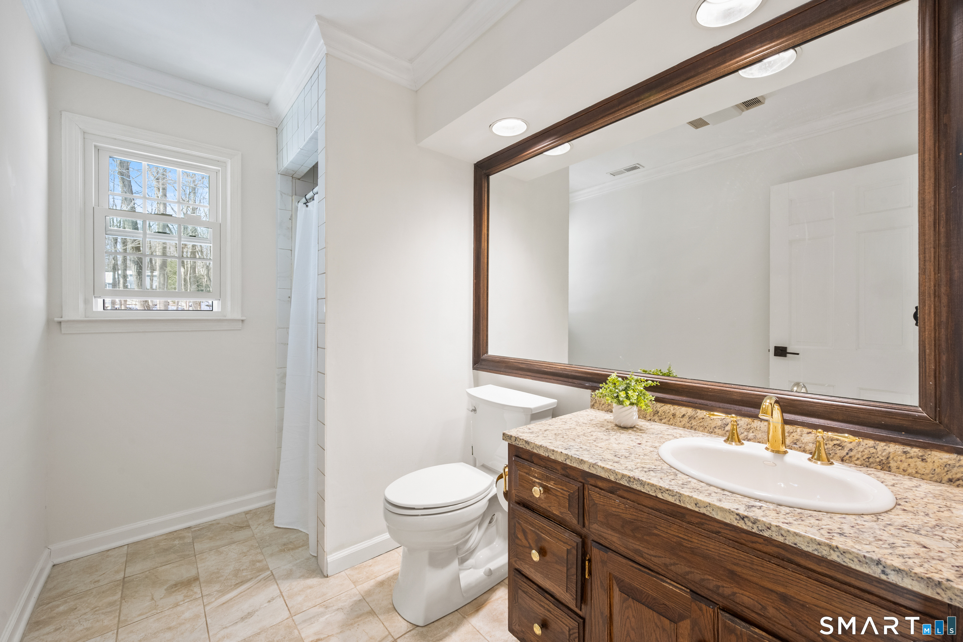 6 Buckboard Lane Fairfield, CT 06824 - Photo 13 of 23 a bathroom with a granite countertop sink toilet and mirror