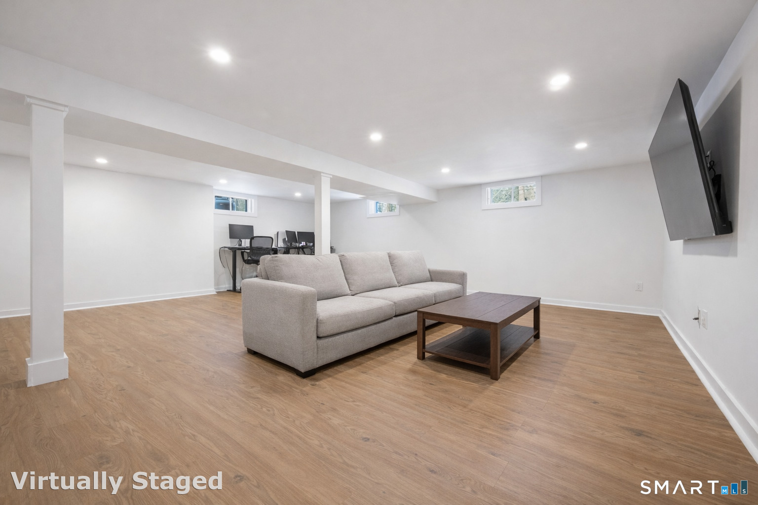 6 Buckboard Lane Fairfield, CT 06824 - Photo 18 of 23 a living room with furniture and a flat screen tv