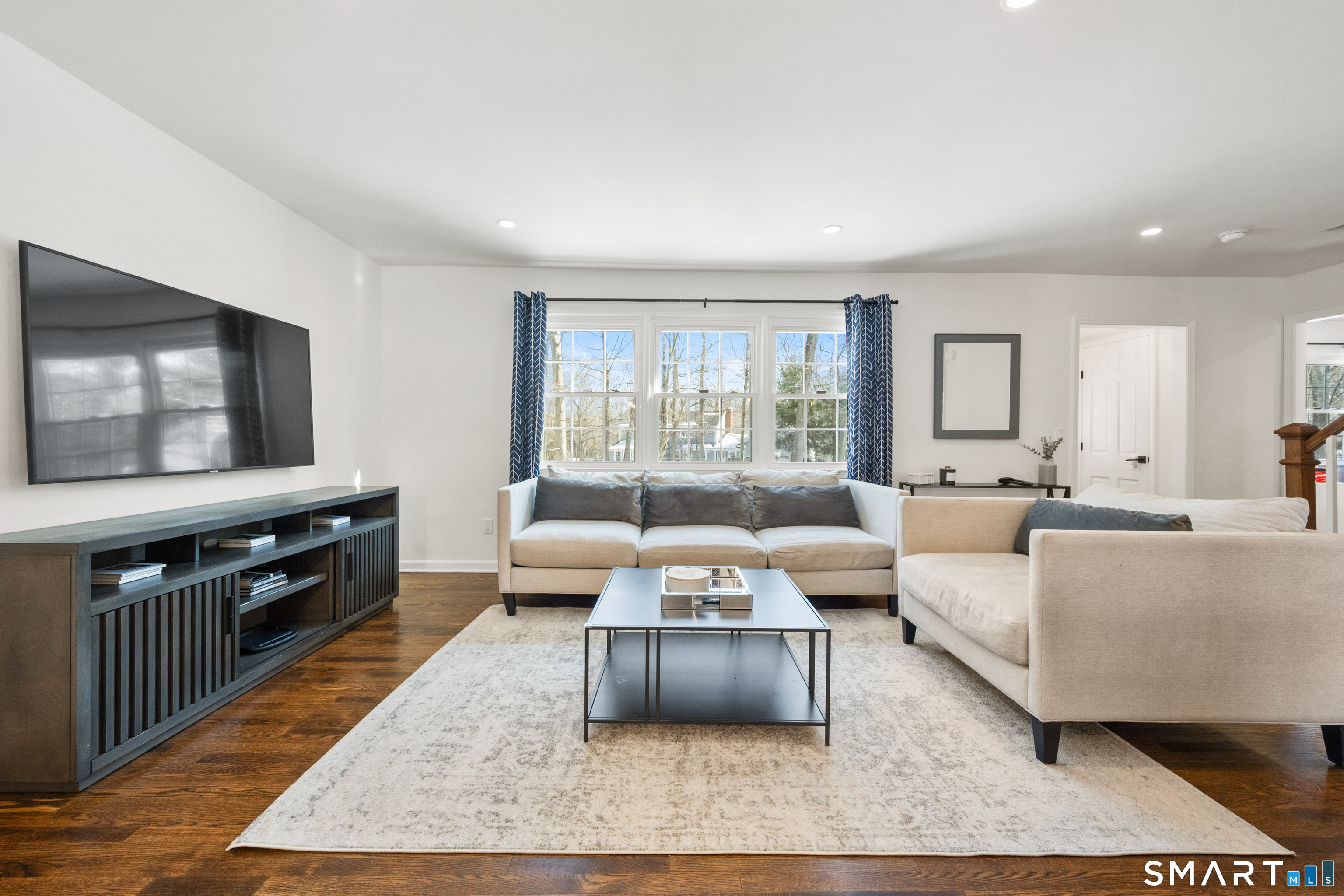 6 Buckboard Lane Fairfield, CT 06824 - Photo 3 of 23 a living room with furniture and a flat screen tv