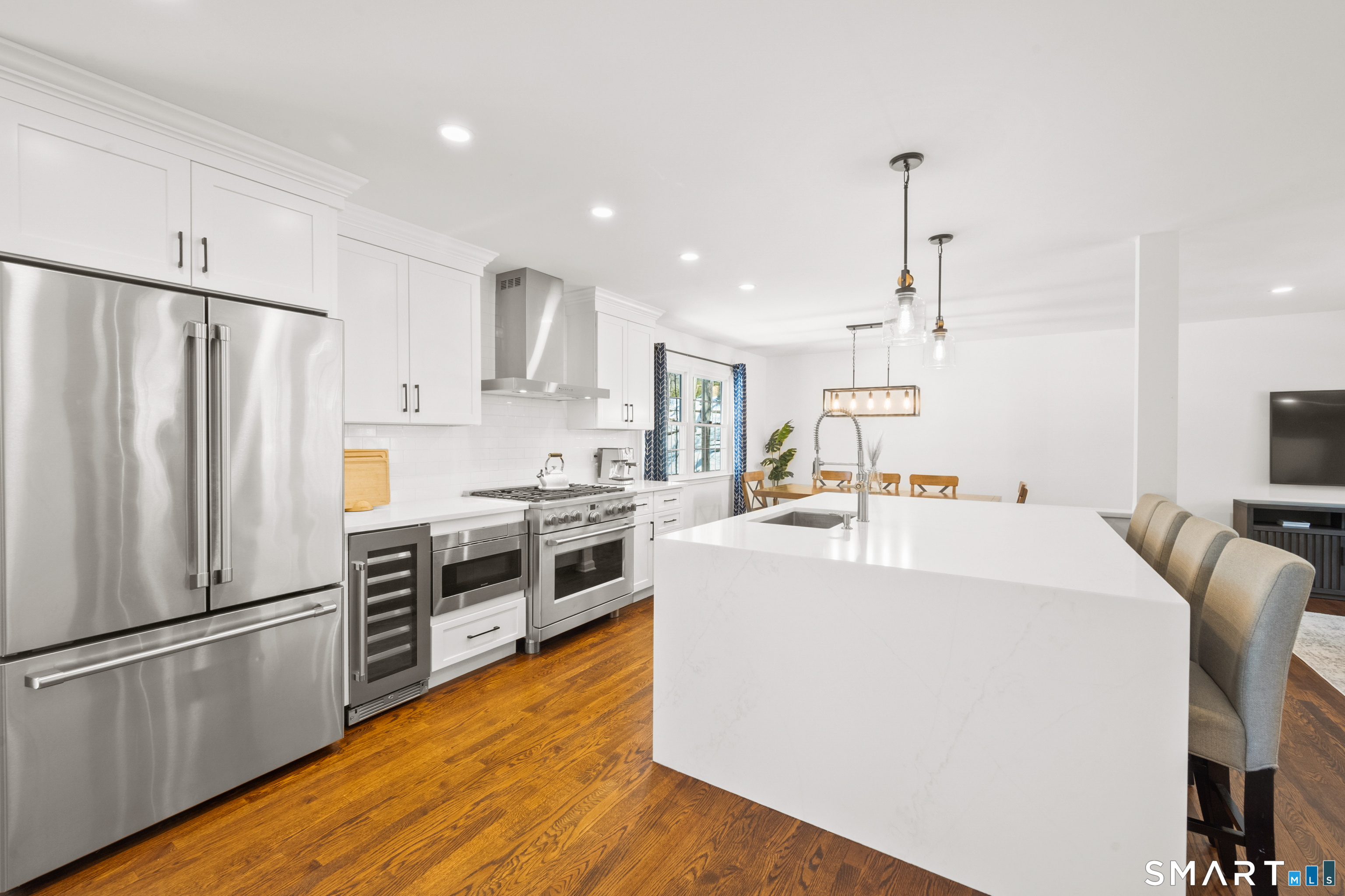 6 Buckboard Lane Fairfield, CT 06824 - Photo 6 of 23 a kitchen with stainless steel appliances a refrigerator sink and stove