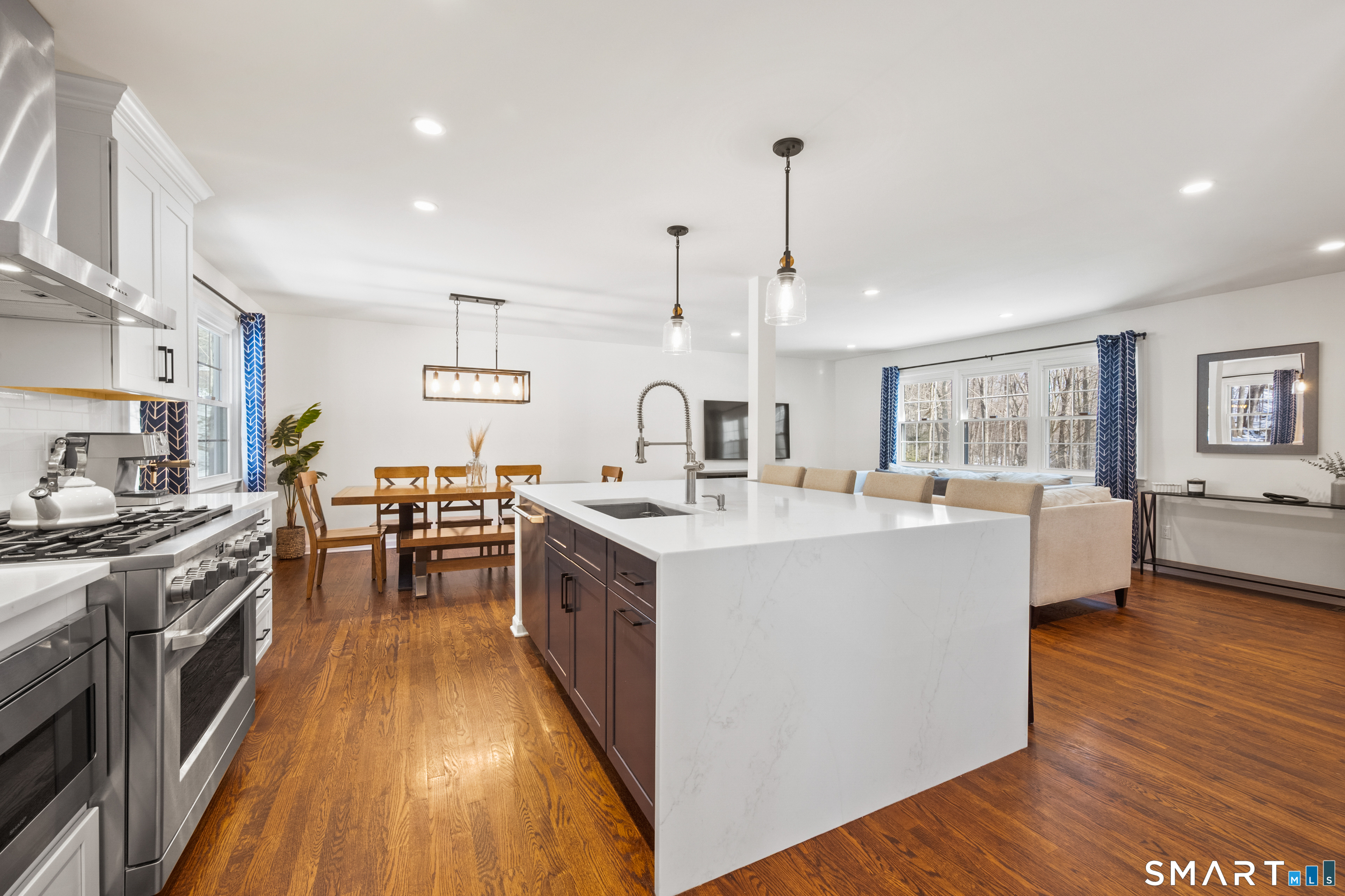 6 Buckboard Lane Fairfield, CT 06824 - Photo 7 of 23 a kitchen with sink stove and wooden floor