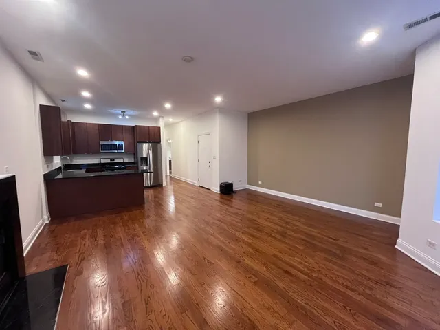 a view of kitchen with wooden floor